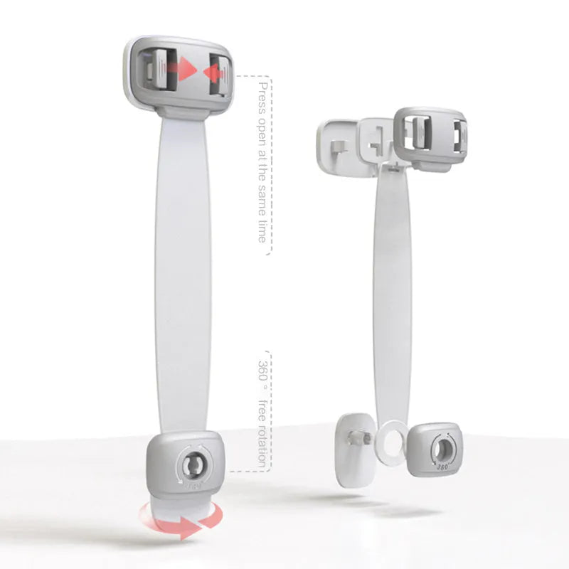 Grey adjustable child safety strap lock with adhesive pads, shown securing a kitchen cabinet door.