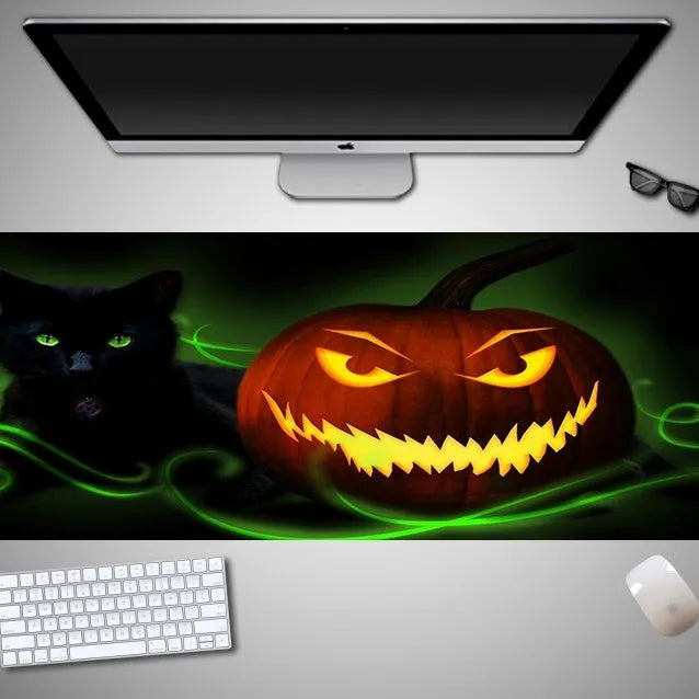 Oversized Halloween pattern rubber cloth mouse pad on a desk with non-slip base.