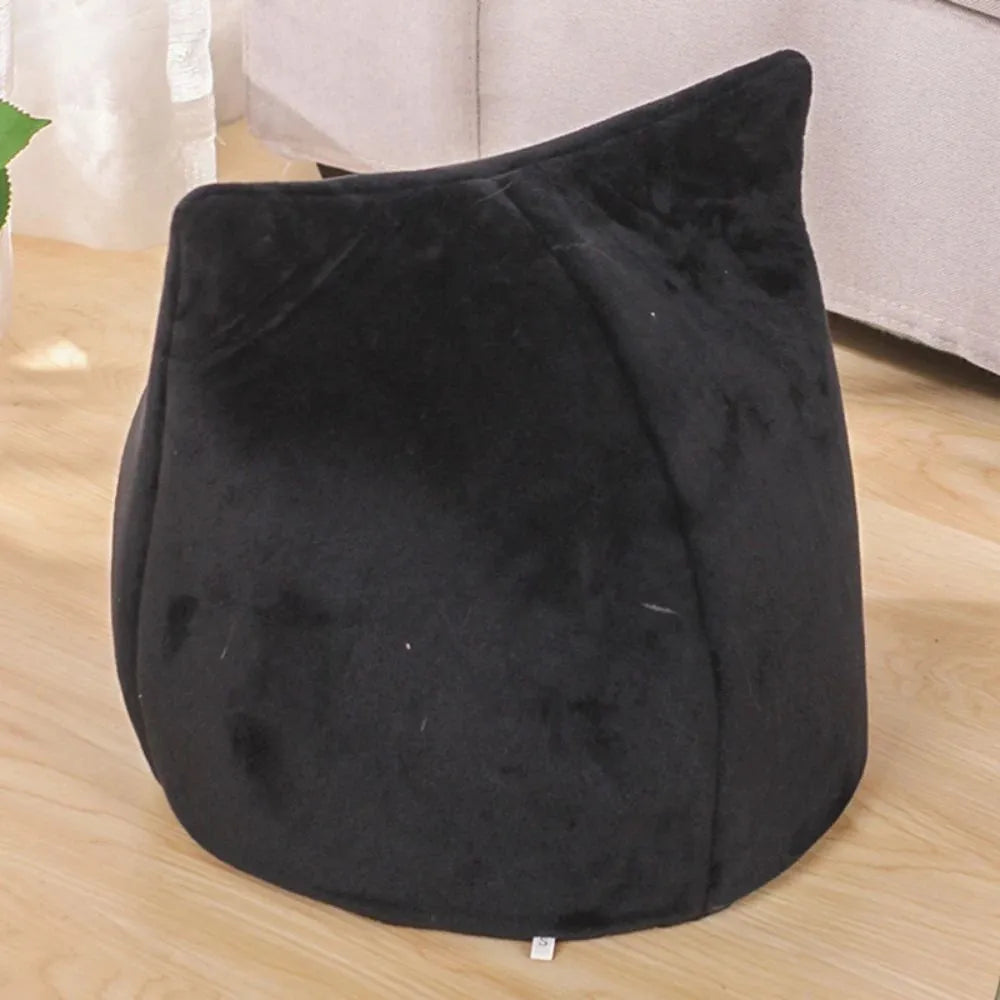 Soft plush covered cat cave bed with anti-slip bottom for cats and small dogs.