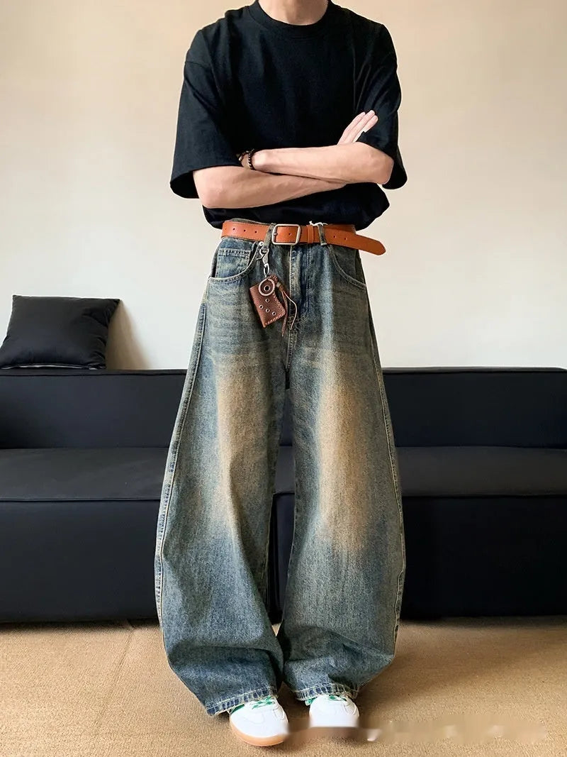 Retro blue distressed men's jeans with wide leg fit and micro elastic cotton blend fabric