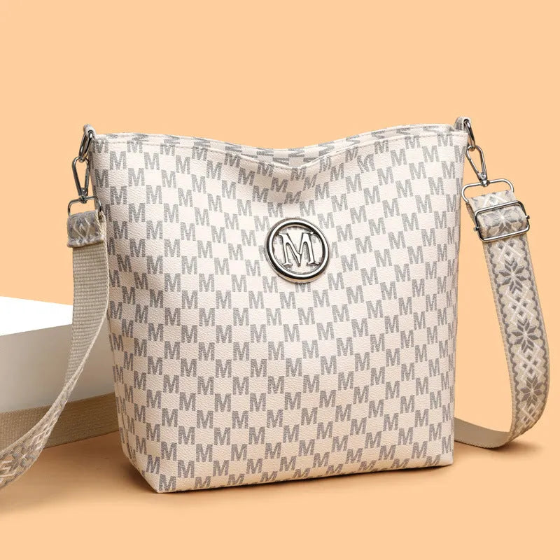 PU leather dumpling shape shoulder bag with sandwich pockets and zippered compartment
