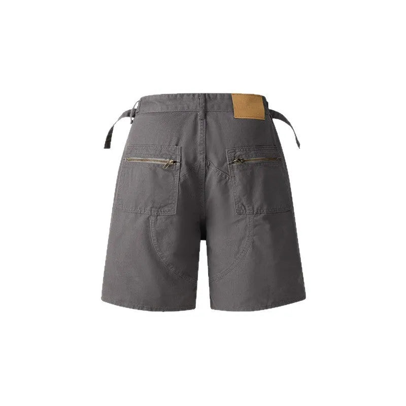 Retro loose-fit washed cotton shorts in camouflage colour on a neutral background.