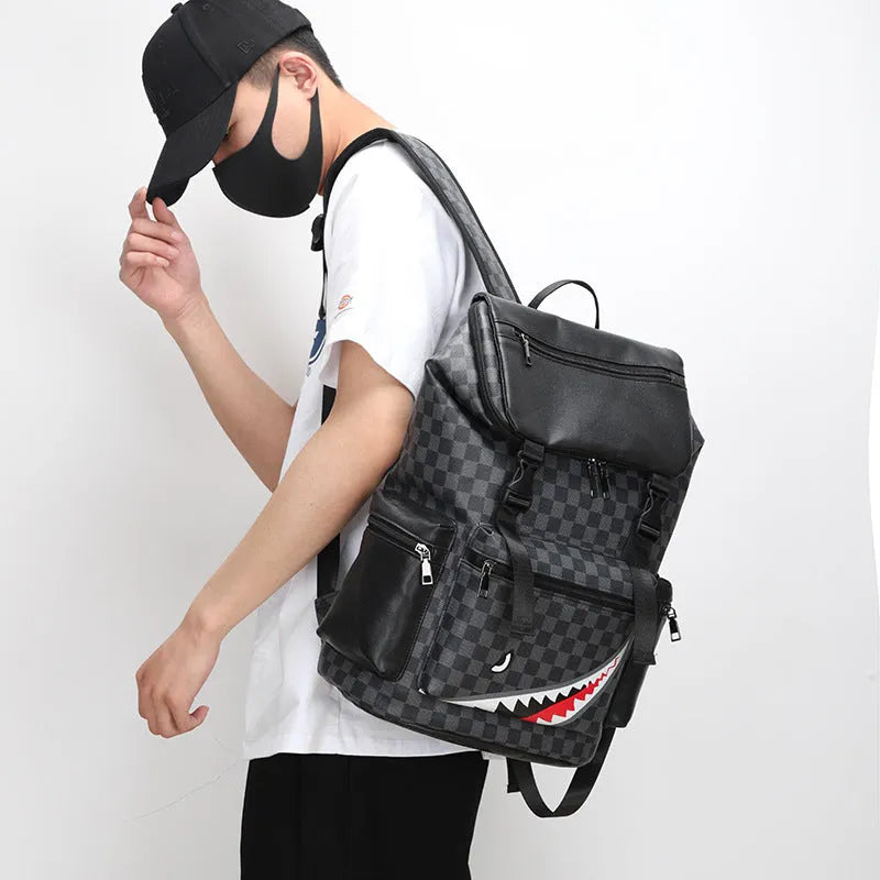 Black checkered printed PU leather backpack with curved shoulder straps shown from front perspective