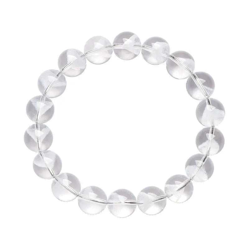 Women's white crystal pyramid bead bracelet with Ruyi design motif on a wrist.