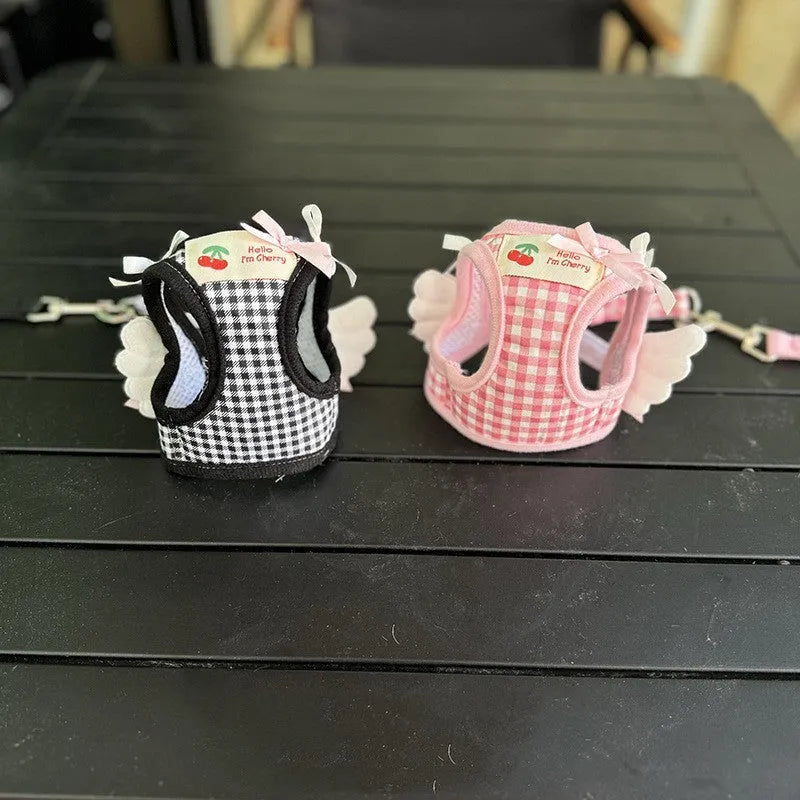 Pink cotton chest and back harness lead for a small dog on a white background.