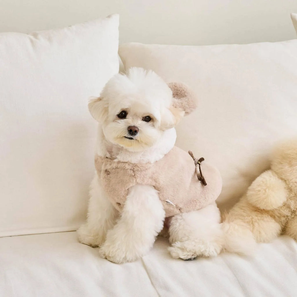 Light pink polyester coat for a dog, showing casual styling and a size range from XS to XL.