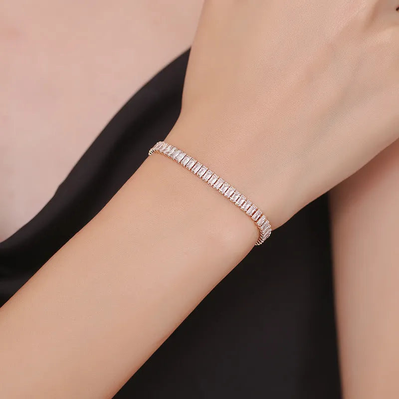 Women's geometric brass bracelet with zircon stones in rectangular design
