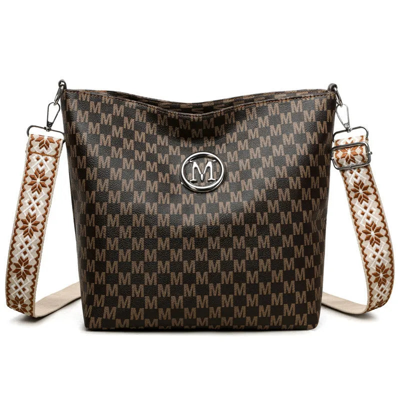 PU leather dumpling shape shoulder bag with sandwich pockets and zippered compartment