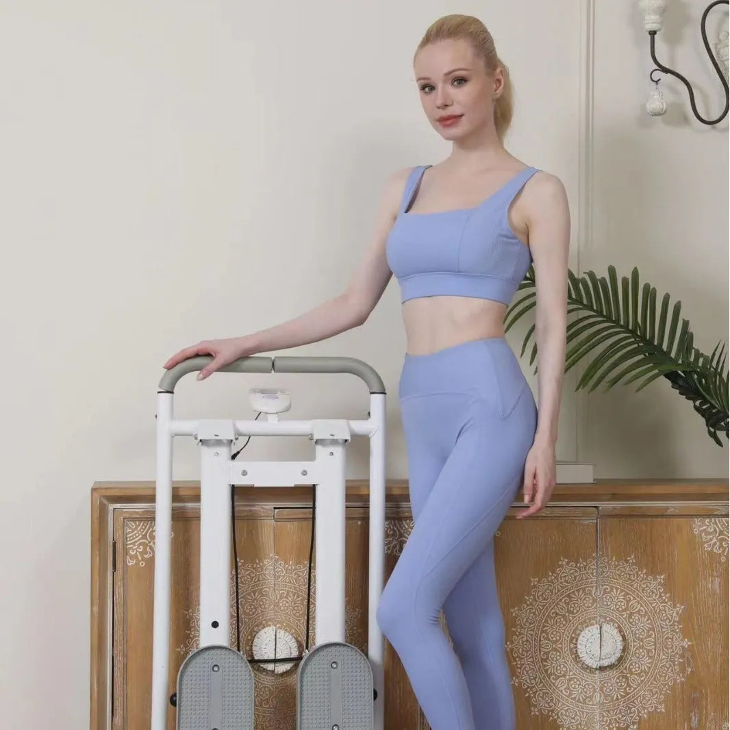 Foldable white multi-function treadmill with integrated indoor climbing frame for home gym.