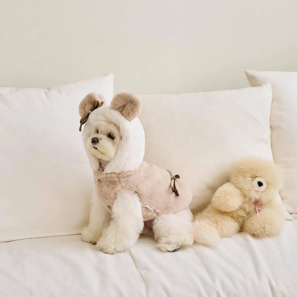 Light pink polyester coat for a dog, showing casual styling and a size range from XS to XL.