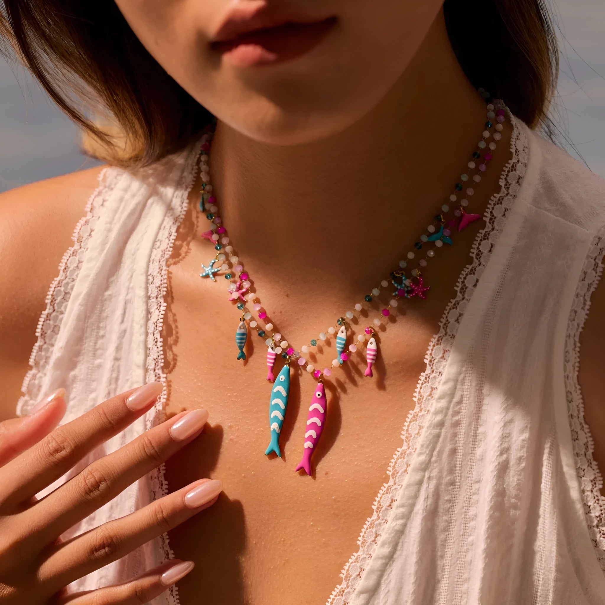 Stainless steel pendant necklace with oil drip beads, starfish design, 18K finish in pink colour, adjustable chain