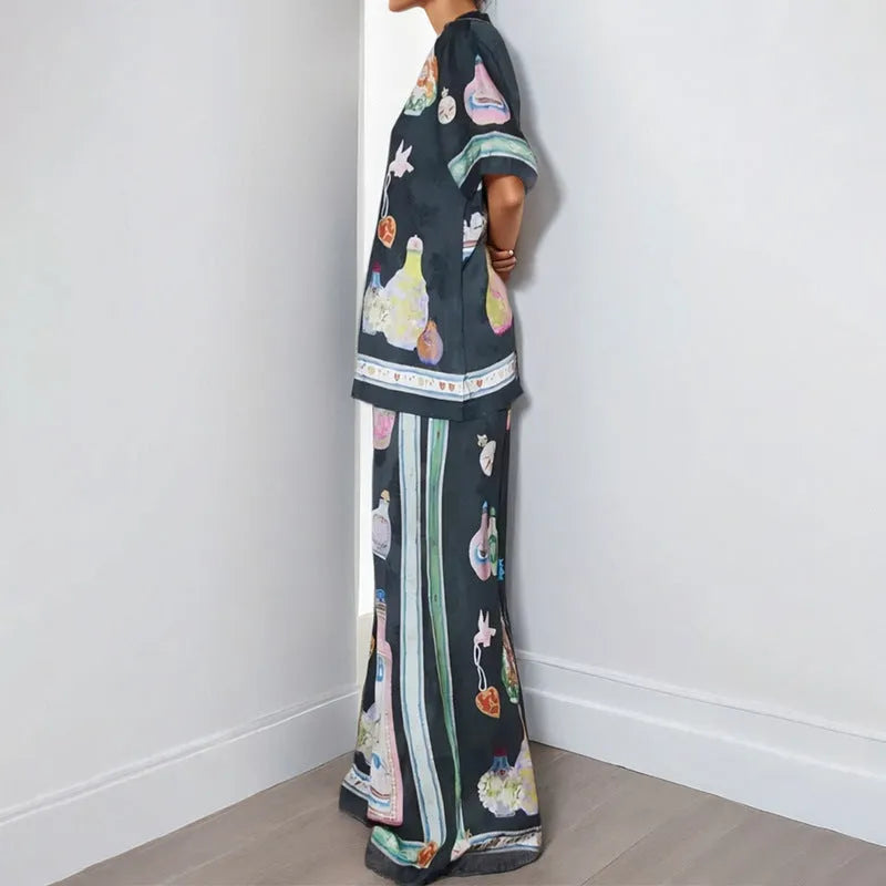Black women's casual set with cartoon print, featuring a sleeve cardigan and trousers