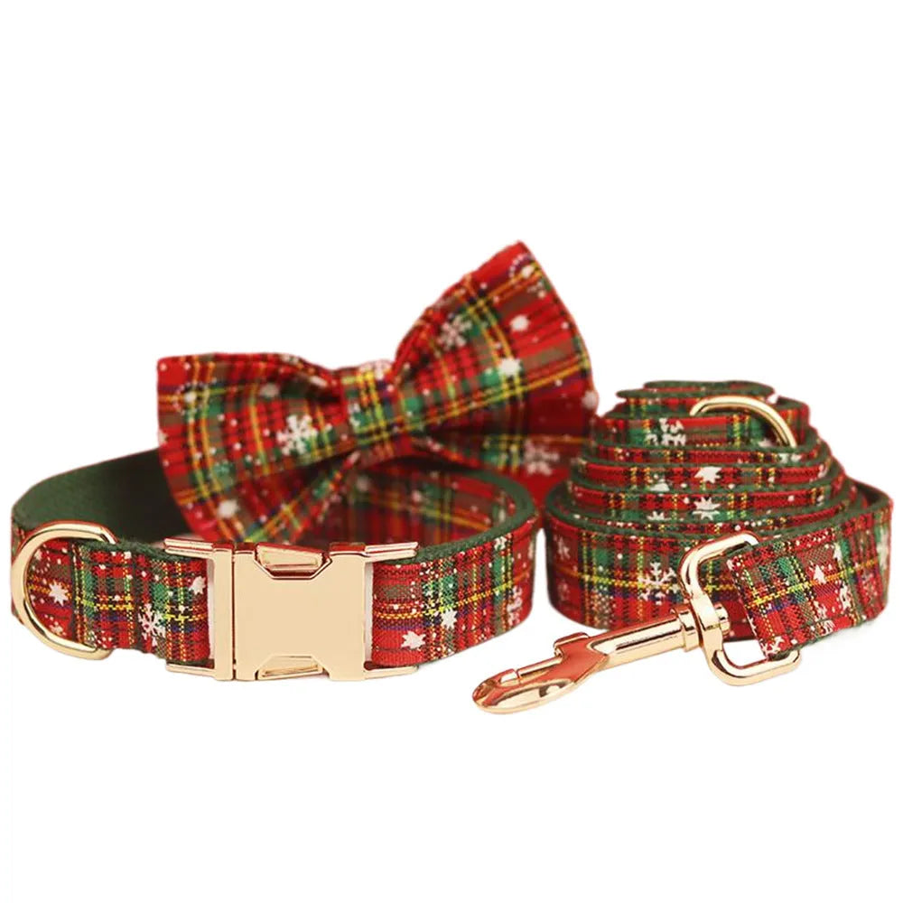 Green snowflake Christmas pet collar set with matching leash, bow, and vest for dogs