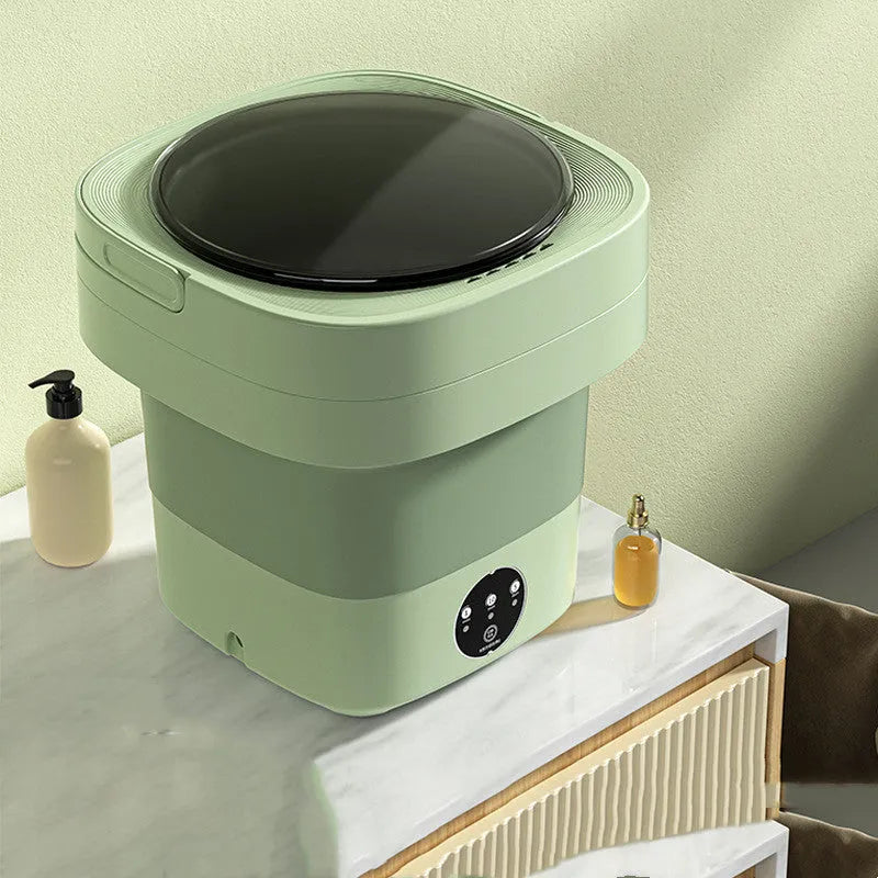 Foldable portable mini washing machine in green colour with drain pipe and basket