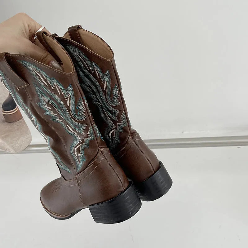 Brown women's mid-calf embroidered Martin boots with a leather lining and a low square heel.