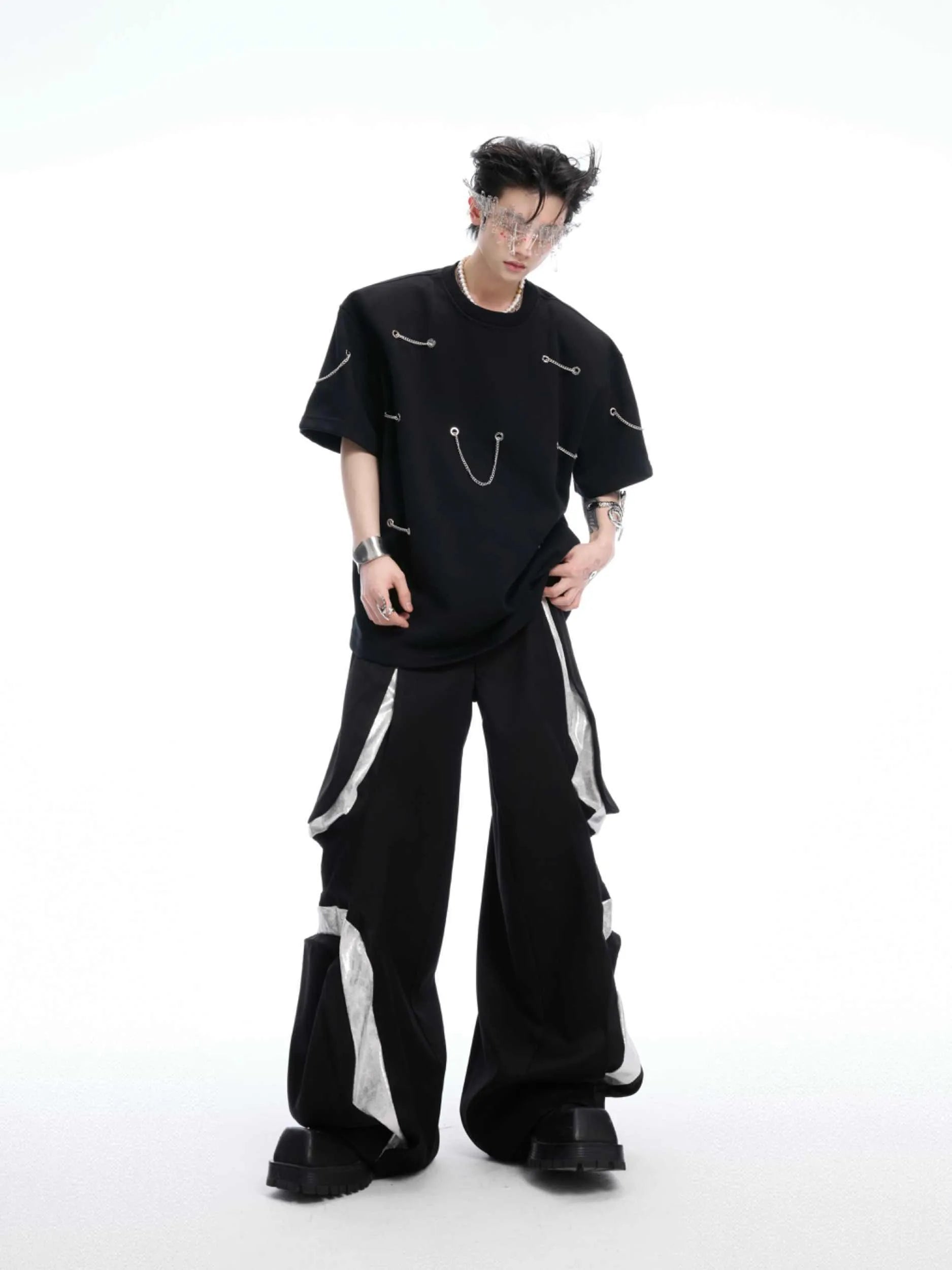 Black men's T-shirt with padded shoulders and metal chain detail, short sleeves, round neck