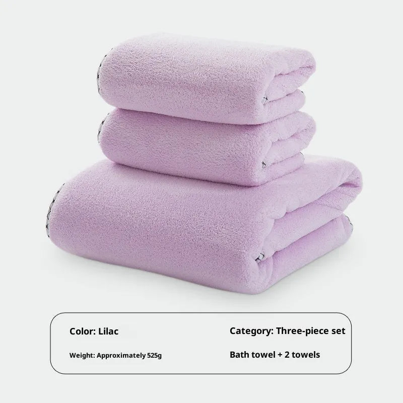 Three-piece coral fleece towel set in vanilla colour with one bath towel and two hand towels on a white background