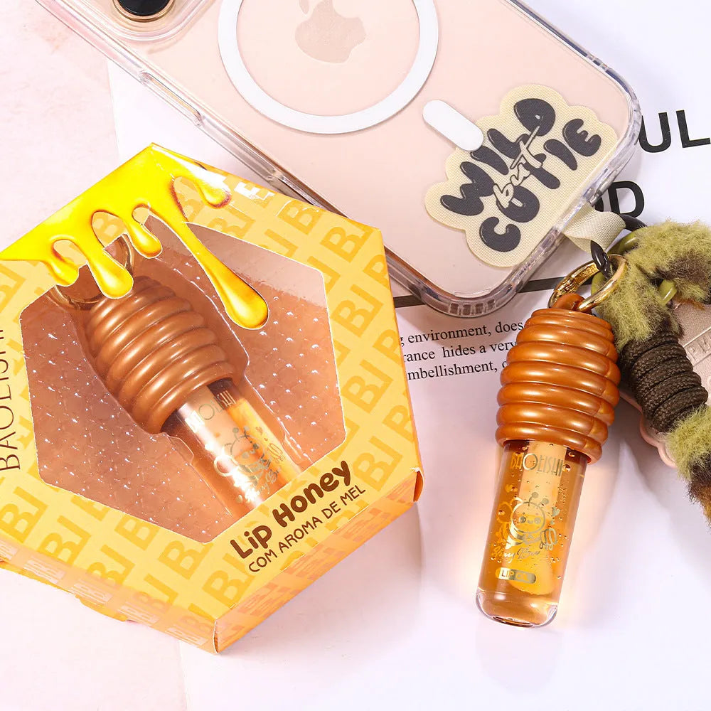 Honey lip gloss with keychain attachment in portable packaging