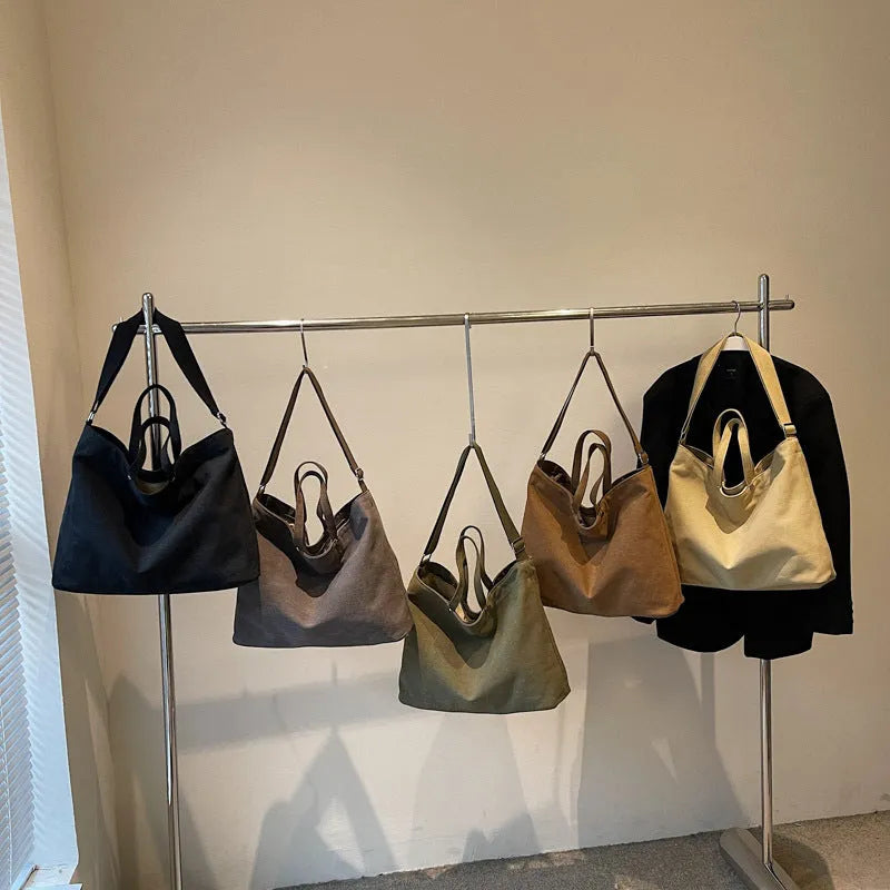 Large capacity women's casual tote bag in khaki cloth with polyester lining, sandwich pocket, and mobile phone bag