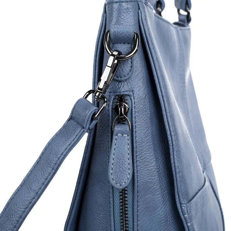 Barrel-shaped crossbody handbag in soft PU leather measuring 30 by 31.5 centimetres