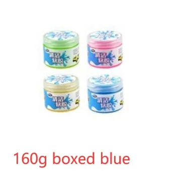 Blue and yellow magic cleaning gel putty for dust removal on a keyboard