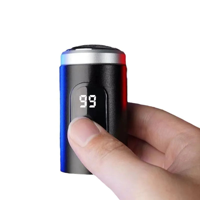Black portable USB rechargeable shaver with cleaning brush and protective cover on a white background.