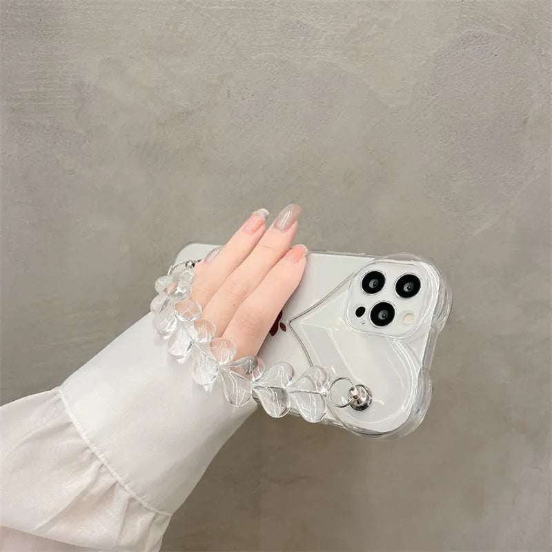 Transparent soft TPU iPhone case with a decorative silver love bracelet chain attached.