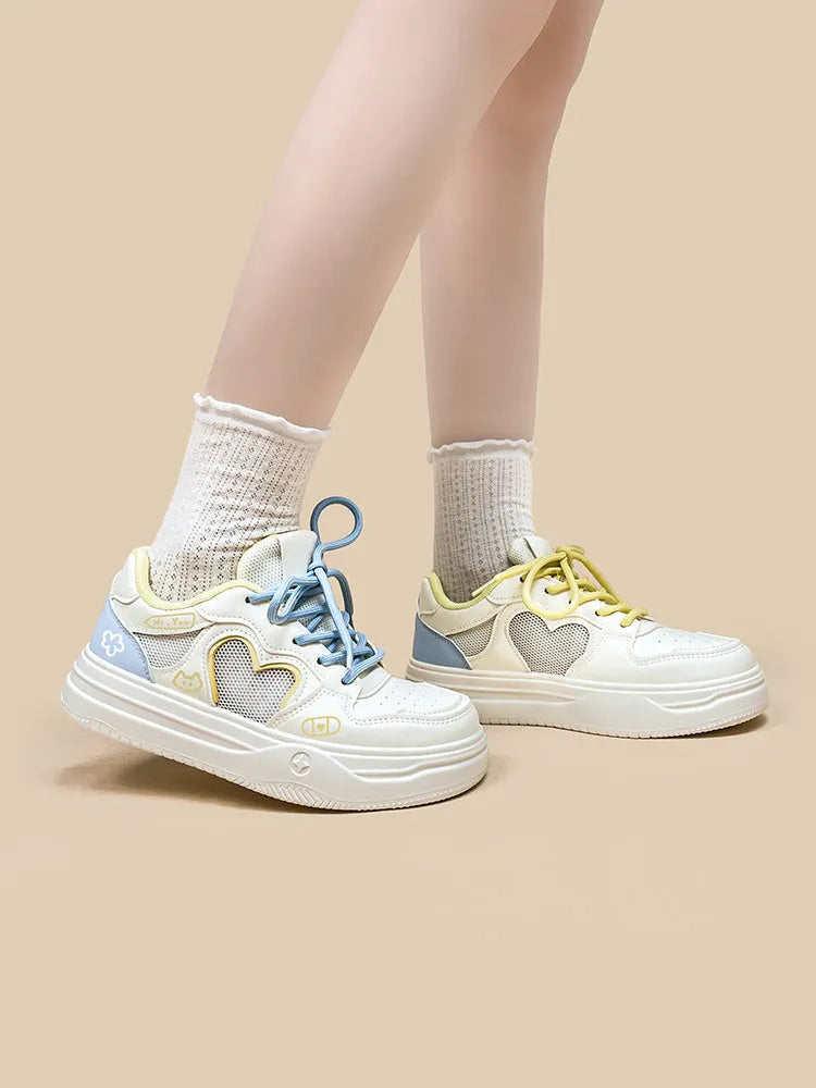Meow Rabbit Sea Salt Cheese coloured sneakers with mesh cross straps and a thick rubber sole.