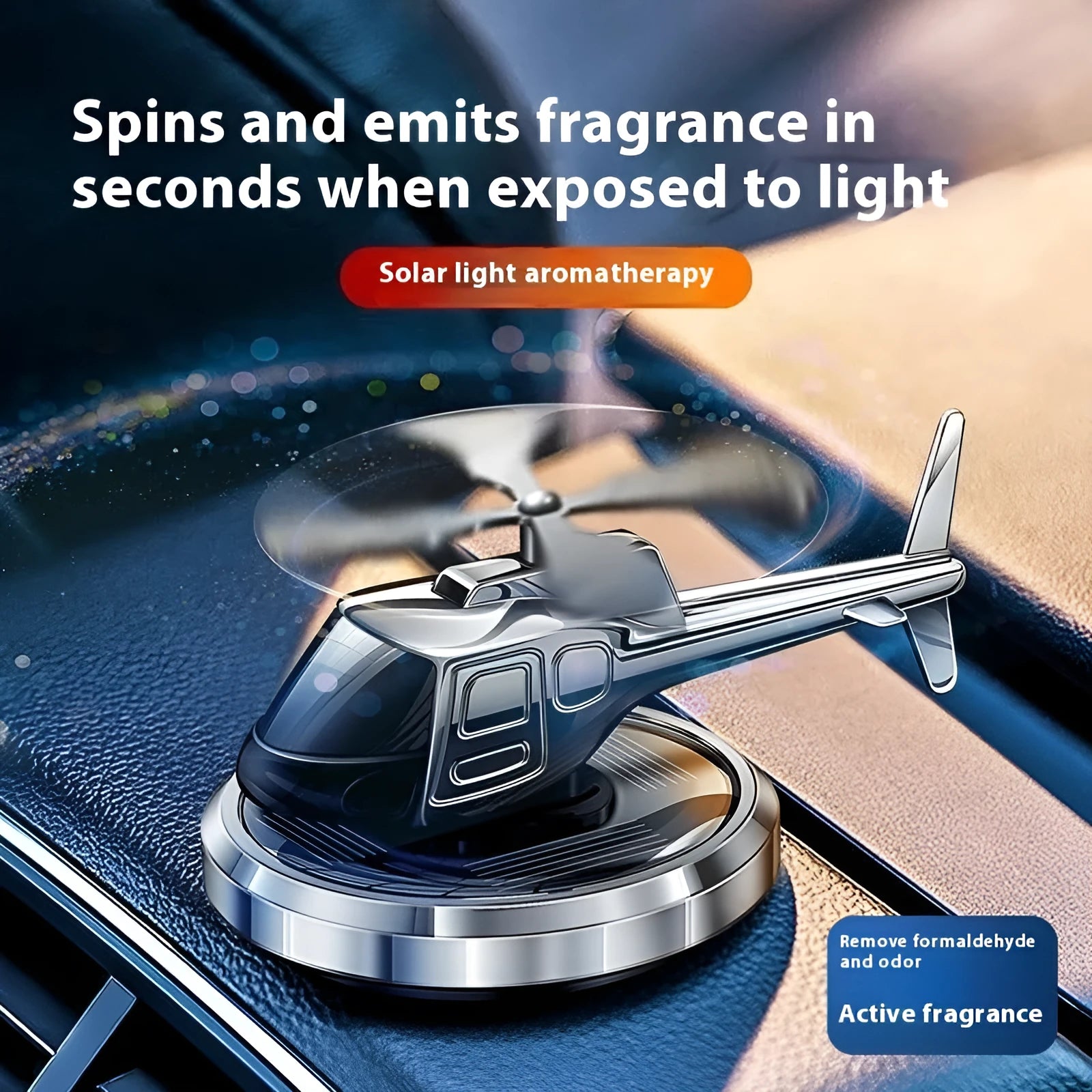 Silver metal solar-powered rotating helicopter car air freshener ornament on a dashboard.