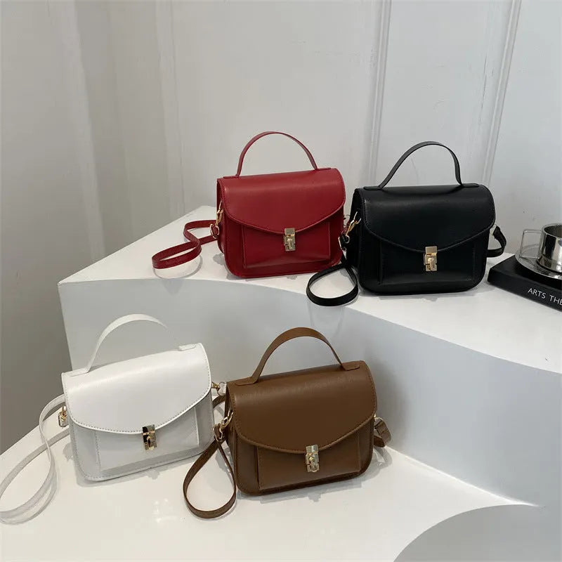 Retro shoulder messenger bag in horizontal square design with crossbody strap and sandwich pocket