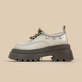 White women's platform Mary Jane shoes with a chunky heel and front lace-up fastening.