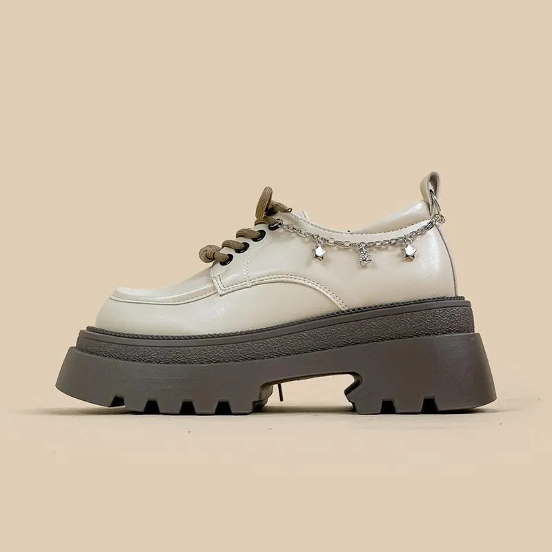 White women's platform Mary Jane shoes with a chunky heel and front lace-up fastening.