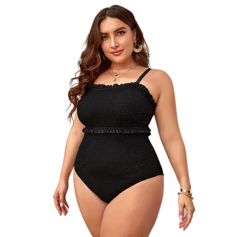 Black plus-size one-piece swimsuit with double shoulder cover and briefs style.