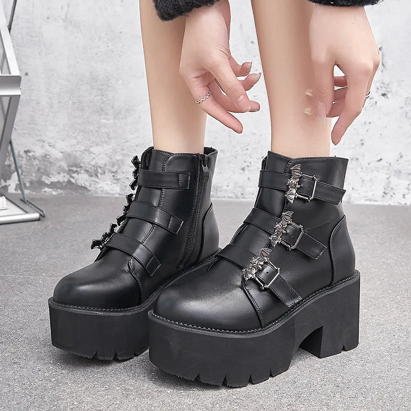 Black ladies punk Martin boots with bat buckle, thick heel, side zip, and round toe.