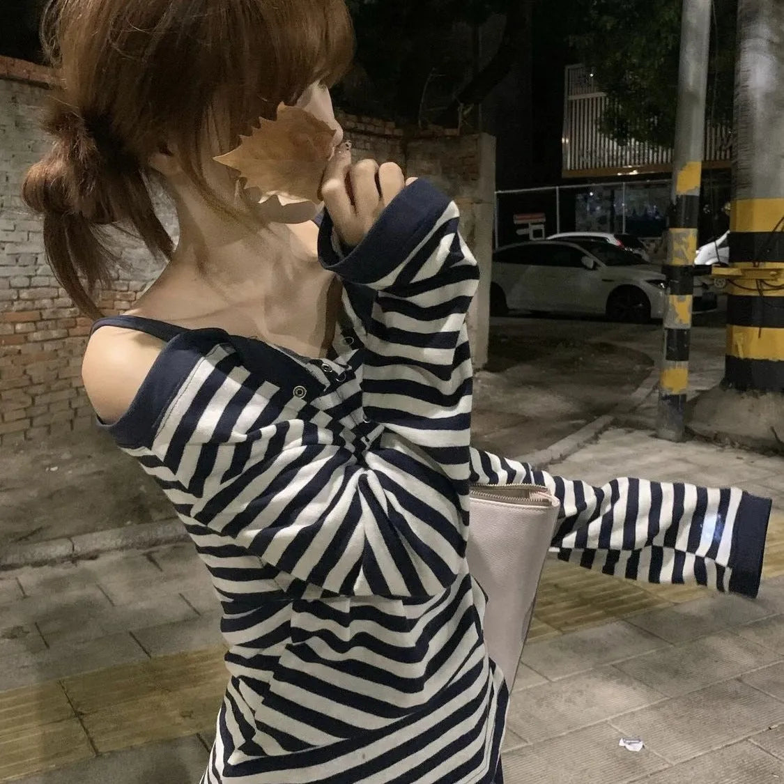 Dark blue women's oversized long sleeve t-shirt with stripes and embroidery detail.
