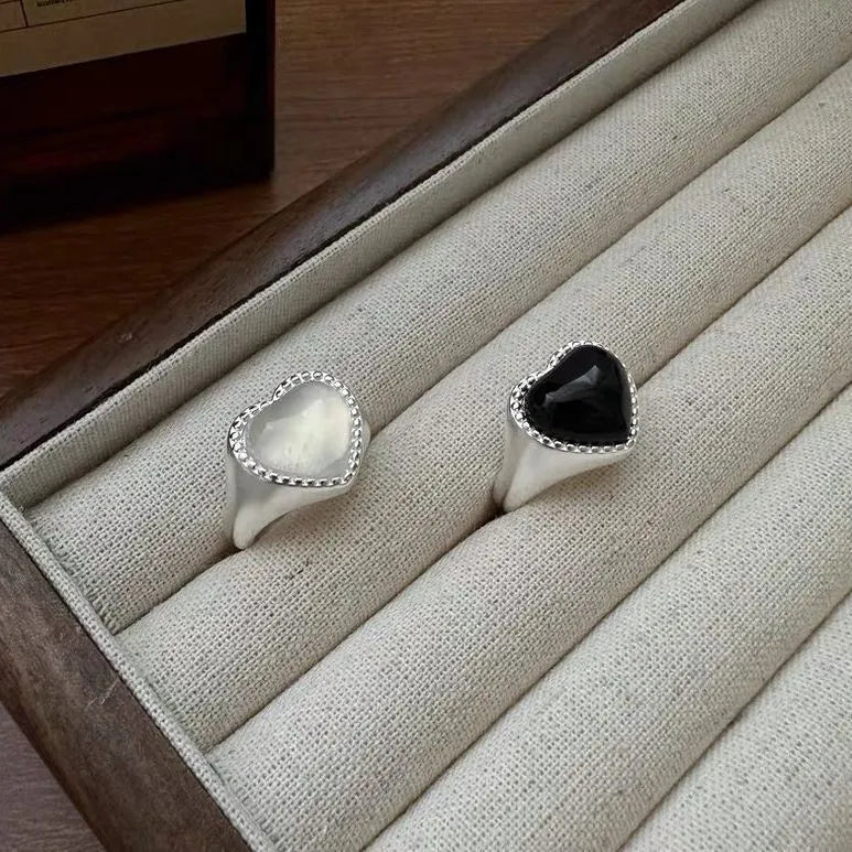 S925 sterling silver ring with black heart agate stone on an adjustable band.