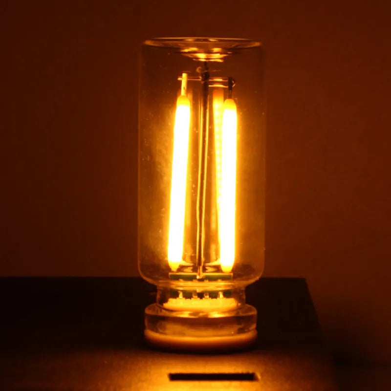Small transparent glass USB touch night lamp in modern minimalist style.