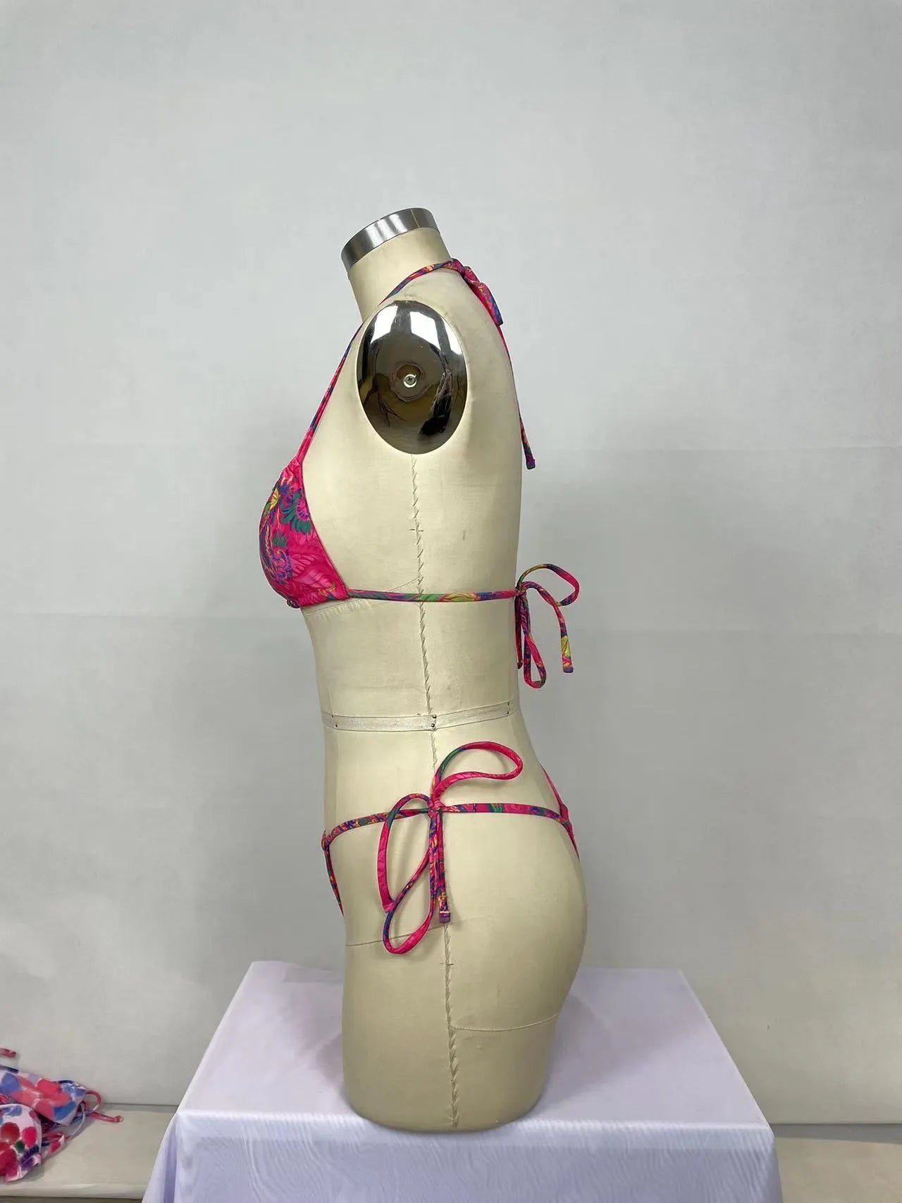 Women's pink nylon bikini two-piece set with sleeveless backless top and briefs bottom