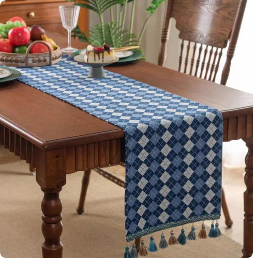 Retro style polyester table flag with long handwoven tassels on a wooden table.