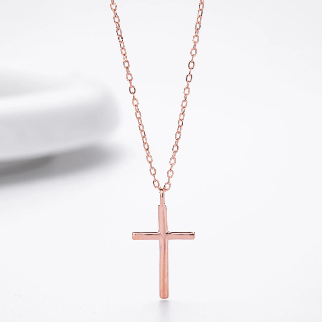 Sterling silver necklace with cross pendant on O-shaped chain showing gold electroplated finish