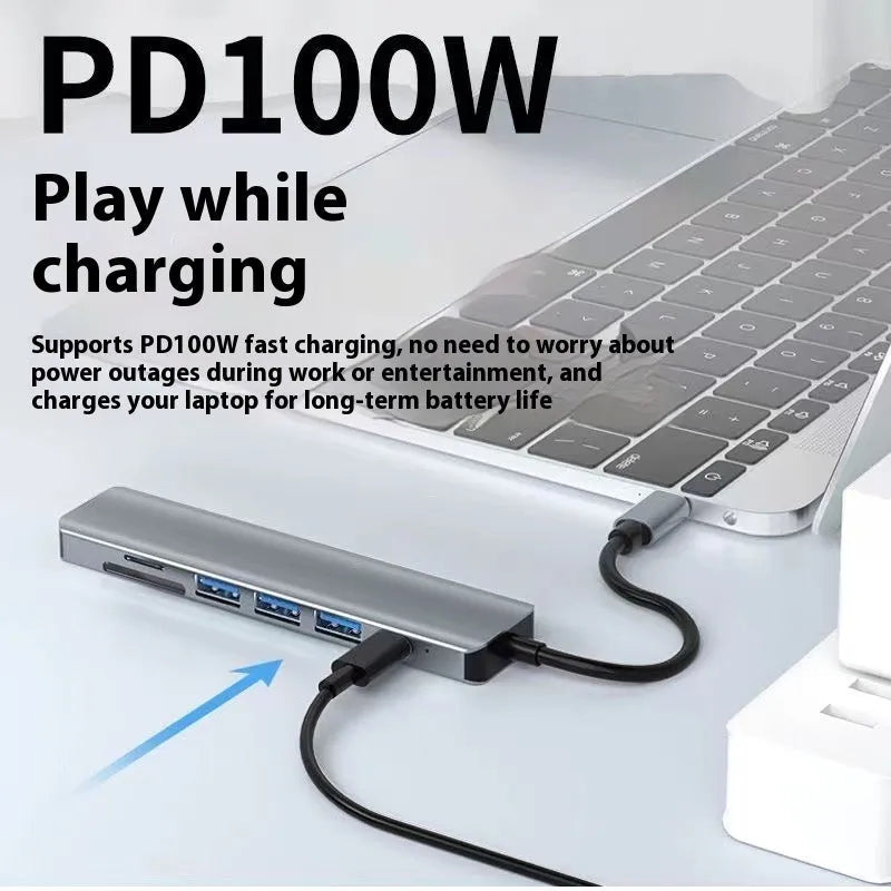 Silver aluminium USB-C 7-in-1 expansion dock with HDMI, VGA, USB 3.0 ports, and a 15cm cable