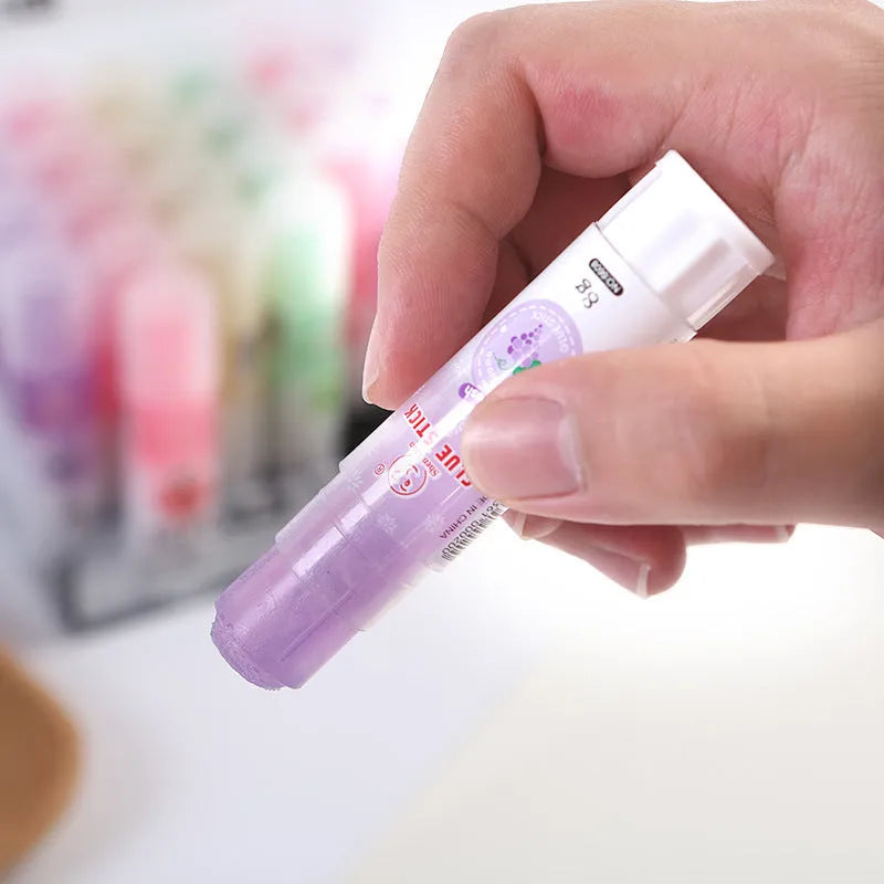 Jelly solid glue stick with fruit printing, 8.5 cm long, shown next to a ruler for scale.