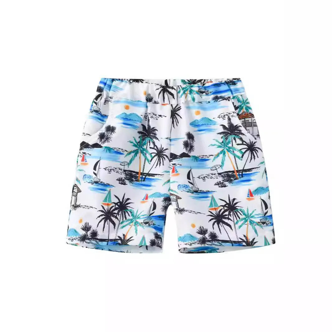 Colourful printed beach shorts with elasticated waistband showing coconut tree design