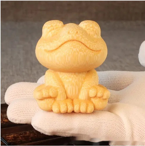 Solid bamboo smiling frog carving ornament with cartoon style measuring 5cm tall