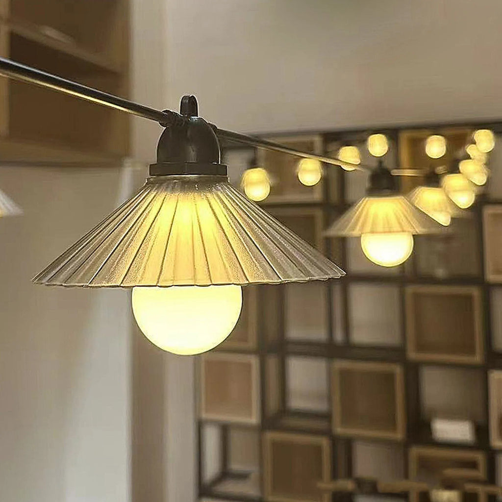 Outdoor LED string lights with flower-shaped bulbs in four colours or warm white, IP65 rated.