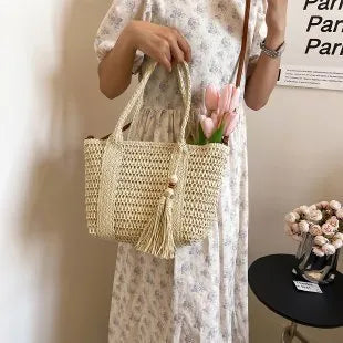 Women's soft straw crossbody bag with diagonal grass weave in milky white or khaki colour