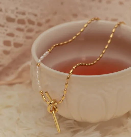 Gold copper real pearl necklace with geometric ring and line design on adjustable chain