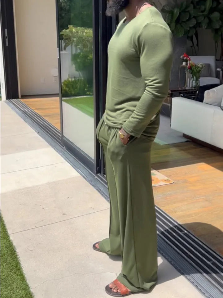 Men's green polyester casual set with long sleeve top and full-length trousers on hanger