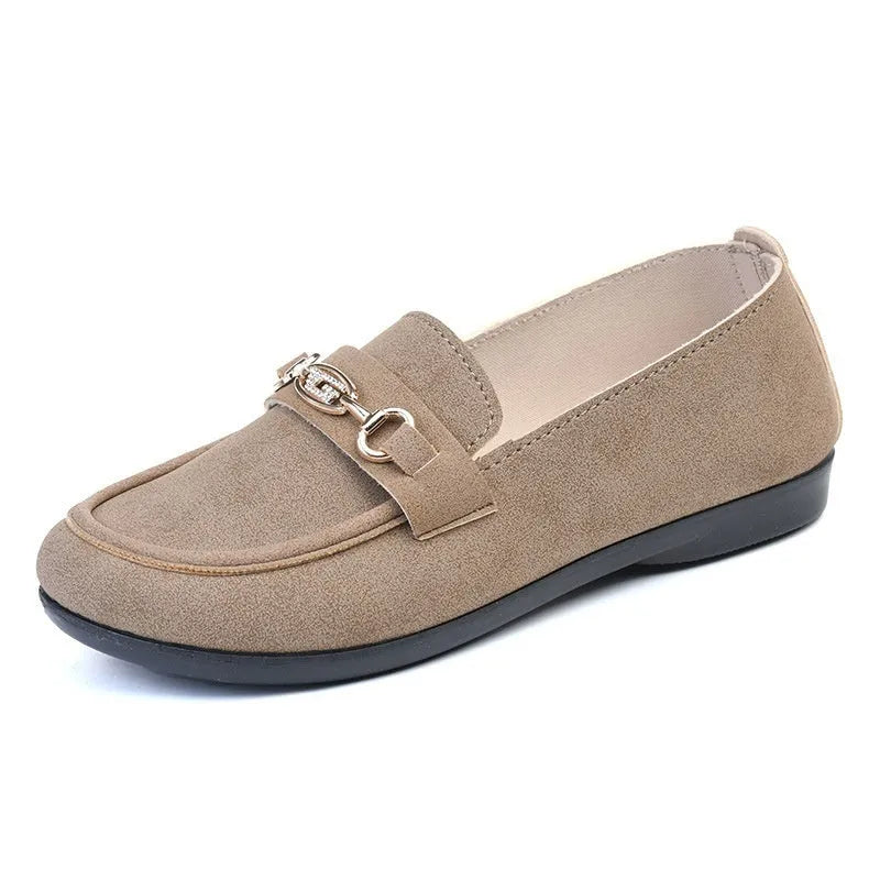 Gommino women's black slip-on casual shoes with a round toe and soft rubber sole on a white background.