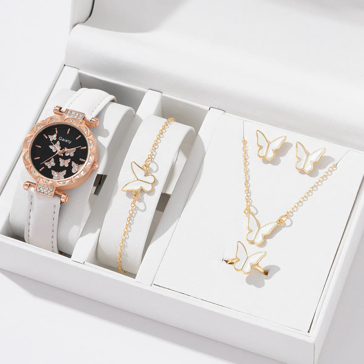 Women's butterfly quartz belt watch with imitation leather strap and pin buckle, available in black brown pink red beige